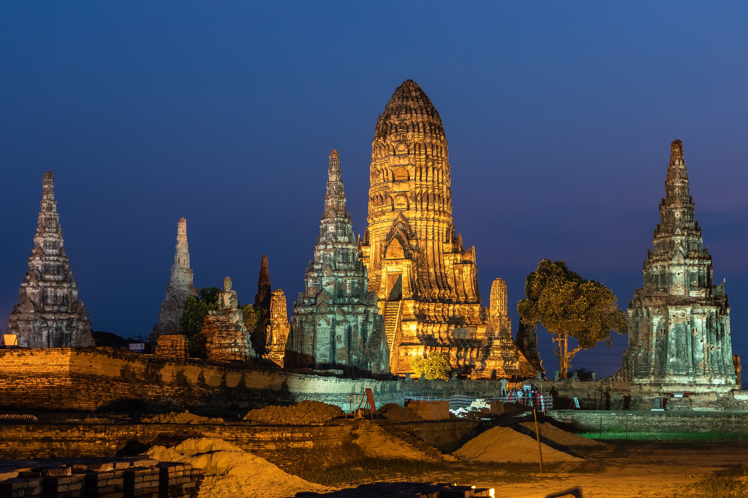 Wat Chaiwatthanaram's prangs lit at dusk, Ayutthaya