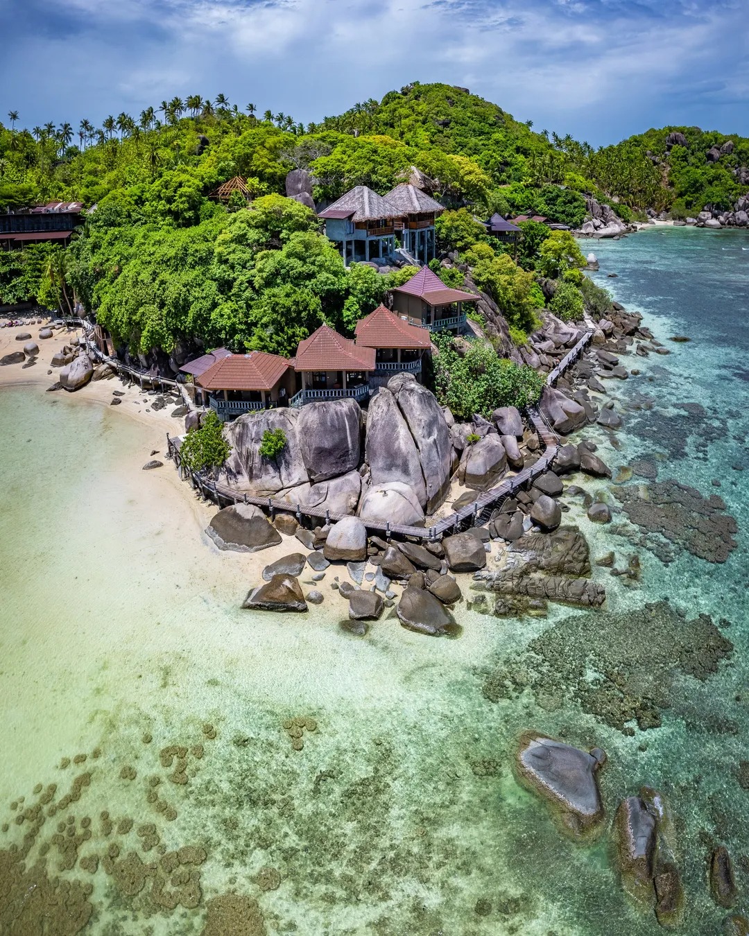 A private resort's pavilions set among granite boulders, Koh Tao