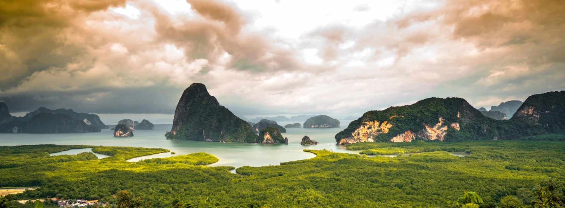 Limestone karst islands rising from a mangrove-fringed bay
