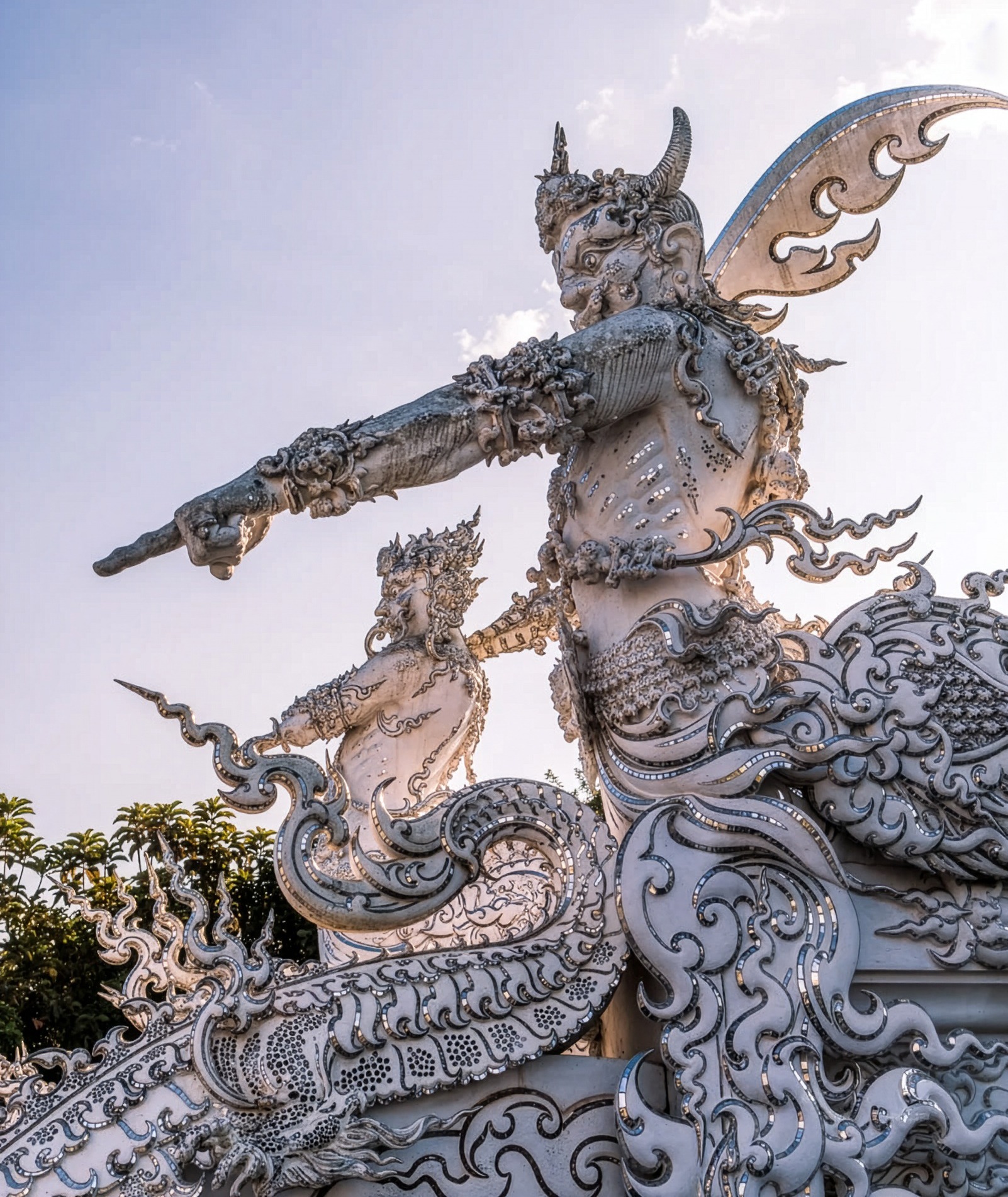 Mirrored guardian figures at Wat Rong Khun, Chiang Rai